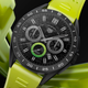 The Tag Heuer Connected Caliber E4 Sport Edition smartwatch with a green rubber strap against a green and black background.